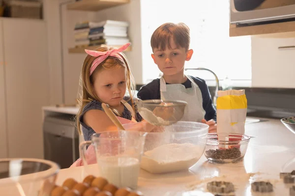 Front View Cute Siblings Concentrating Hard Prepare Cookies Kitchen Home — Stock Photo, Image