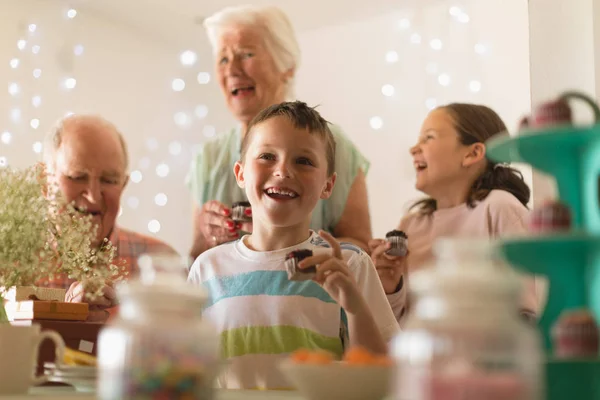 Happy Multi Generation Family Eating Cupcake Home Grandsons Birthday — Stock Photo, Image