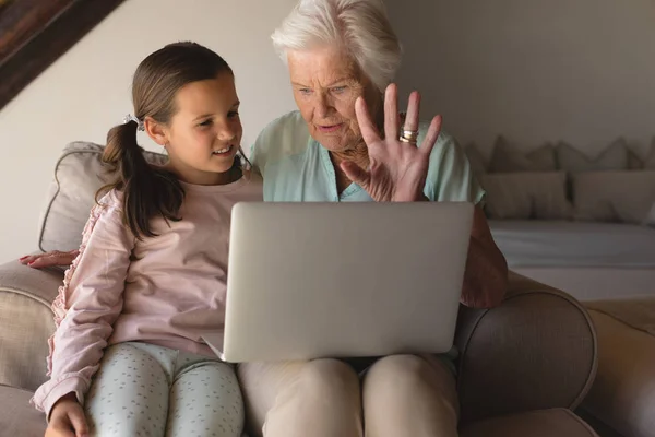 Front View Grandmother Granddaughter Discussing Laptop Living Room Home — Stock Photo, Image