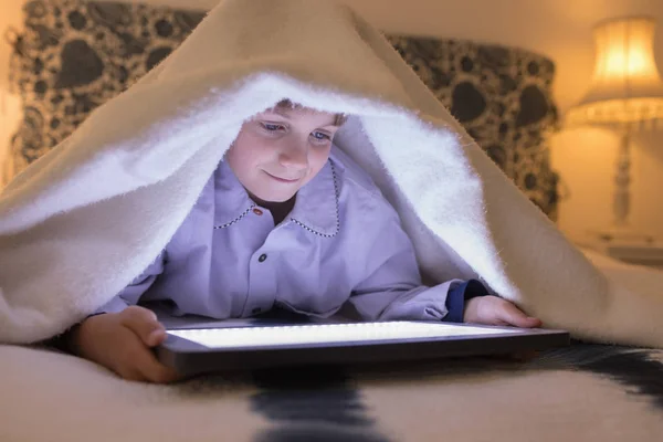 Front View Adorable Boy Blanket Using Digital Tablet Bedroom Home — Stock Photo, Image