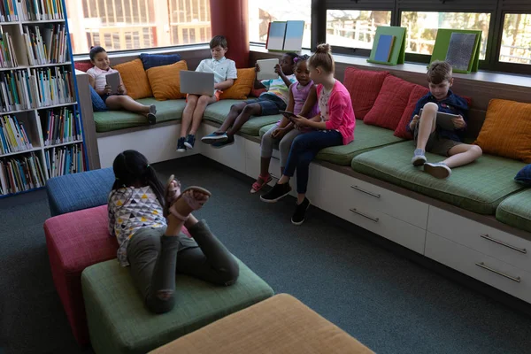 Front View Group Schoolkids Studying While Sitting Couch School Library — Stock Photo, Image