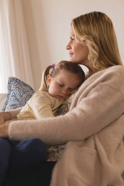 Side View Smiling Mother Embracing Her Sleeping Daughter Arms Home — Stock Photo, Image