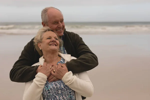 Front View Active Senior Couple Embracing Standing Beach Ocean Background — Stock Photo, Image