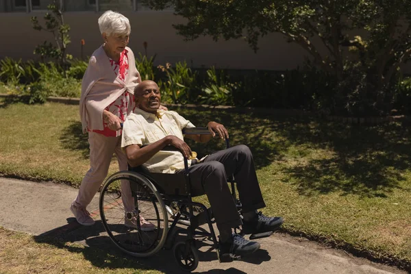 Front View Senior Woman Pushing Senior Man Wheelchair Sunny Day — Stock Photo, Image