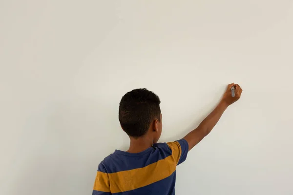 Rear View Young Handsome Mixed Race Boy Writing White Wall — Stock Photo, Image