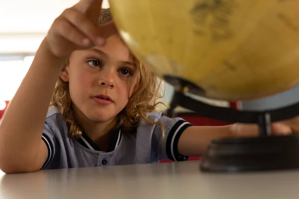 Front View Schoolboy Studying Earth Globe Desk Classroom Elementary School — Stock Photo, Image