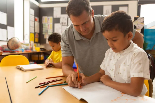 Front View Handsome Caucasian Male Teacher Teaching Mixed Race Schoolboy — Stock Photo, Image
