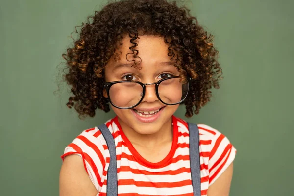 Front View Mixed Race Schoolboy Smiling Camera While Standing Green — Stock Photo, Image