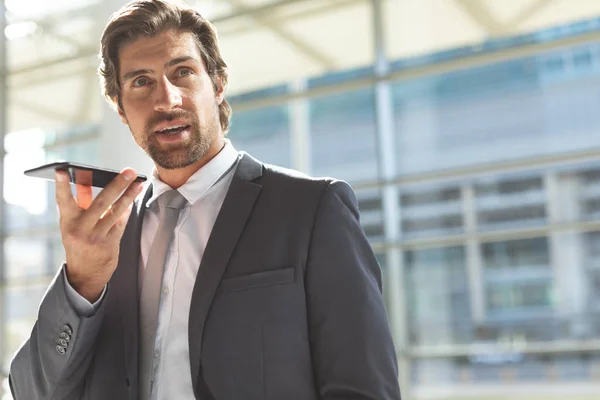 Front View Young Caucasian Businessman Talking Mobile Phone Lobby Office — Stock Photo, Image