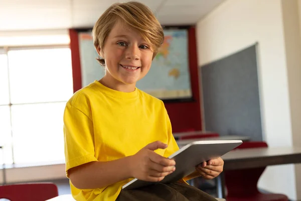 Front View Happy Caucasian Boy Digital Tablet Sitting Desk Looking — Stock Photo, Image