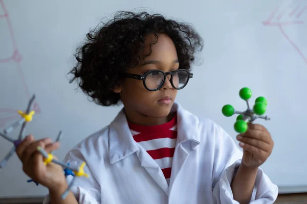 Front View Mixed Race Schoolboy Holding Examining Different Molecule Model — Stock Photo, Image