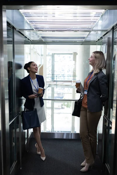 Front View Happy Young Multi Ethnic Businesswomen Coffee Cup Interacting — Stock Photo, Image