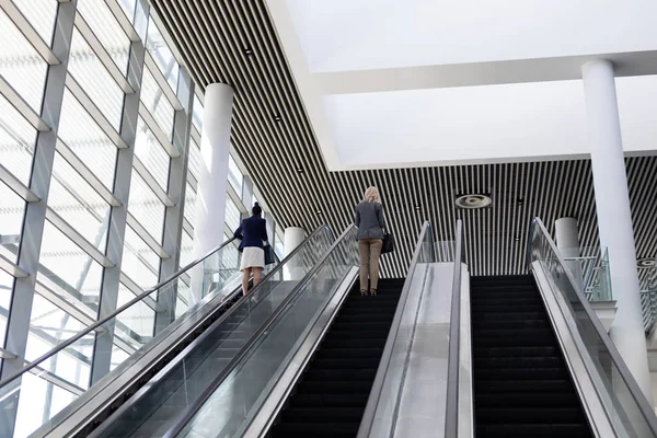 Low Angle View Young Multi Ethnic Businesswomen Using Escalator Modern — Stock Photo, Image