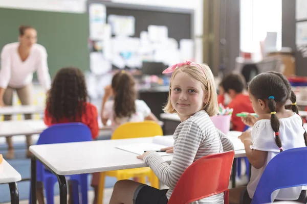 Rear View Caucasian Schoolgirl Looking Camera Sitting Red Chair Next — Stock Photo, Image
