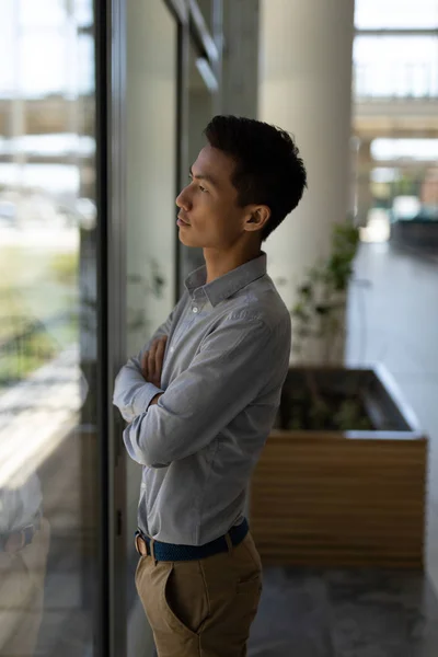 Side View Young Asian Male Executive Standing Arms Crossed Modern — Stock Photo, Image