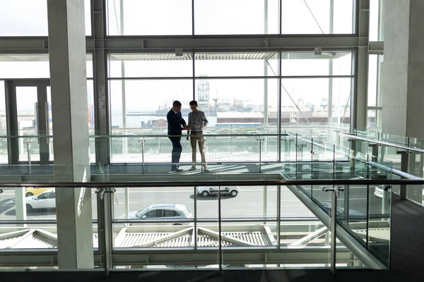 Front Distant View Two Businessmen Looking Digital Tablet First Floor — Stock Photo, Image