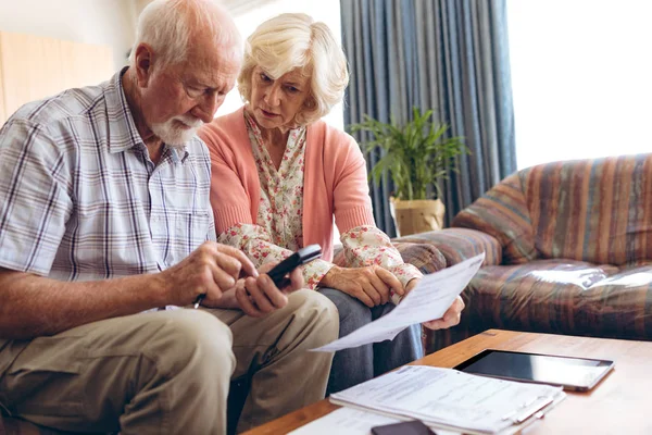 Front View Active Senior Caucasian Couple Calculating Bill While Sitting — Stock Photo, Image