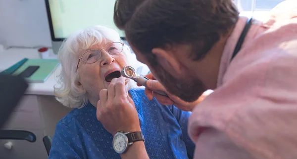 Rear View Caucasian Male Doctor Checking Senior Female Patient Mouth — Stock Photo, Image