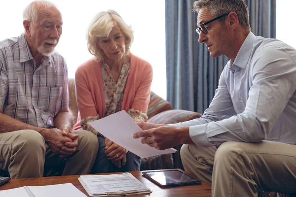 Front View Matured Caucasian Male Physician Interacting Showing Medical Papers — Stock Photo, Image