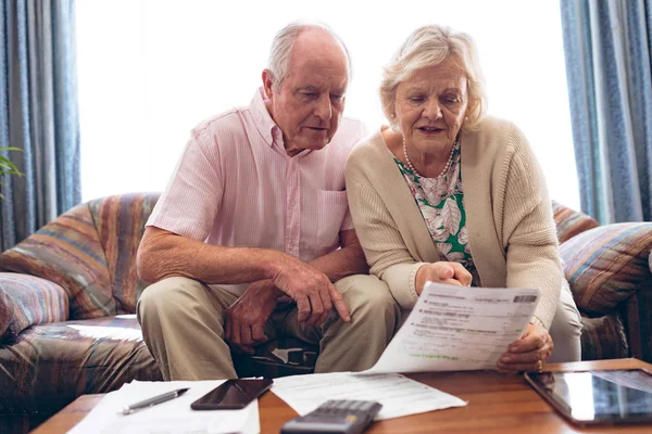 Front View Senior Caucasian Couple Discussing Medical Bill While Sitting — Stock Photo, Image