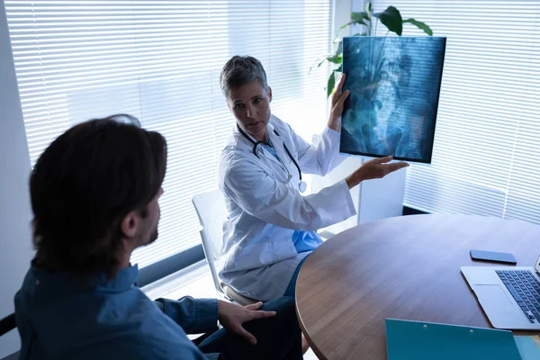 Front View Mature Caucasian Female Doctor Showing Ray Report Caucasian — Stock Photo, Image