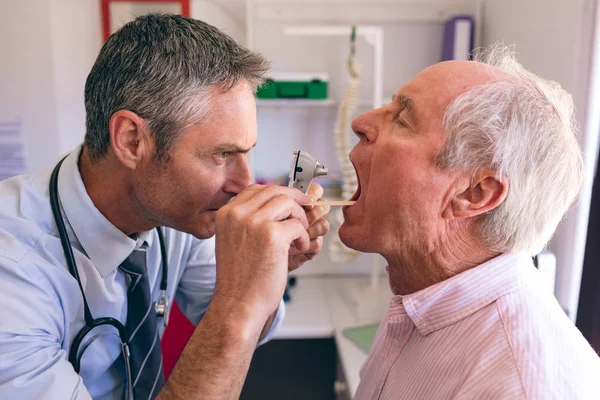 Side View Male Caucasian Doctor Checking Senior Male Caucasian Patient — Stock Photo, Image