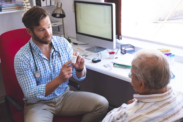 Front View Confident Caucasian Male Doctor Prescribing Pills His Senior — Stock Photo, Image