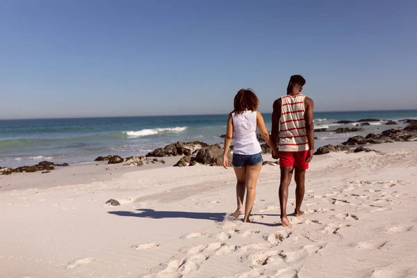 Rear View Mixed Race Couple Holding Hands Walking Beach Sunshine — Stock Photo, Image