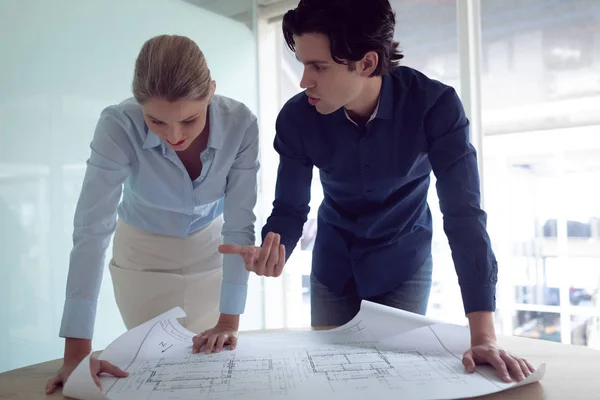 Front View Caucasian Male Female Architects Discussing Blueprint Office — Stock Photo, Image