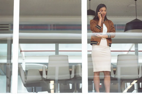 Front View Beautiful Mixed Race Businesswoman Talking Mobile Phone Window — Stock Photo, Image