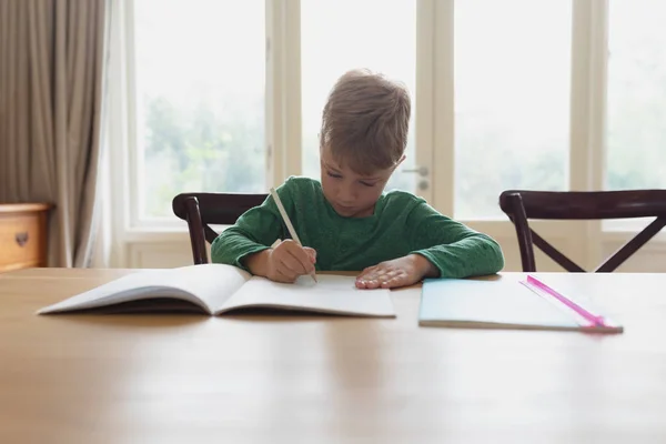 Front View Cute Caucasian Boy Doing Homework Dining Table Comfortable — Stock Photo, Image