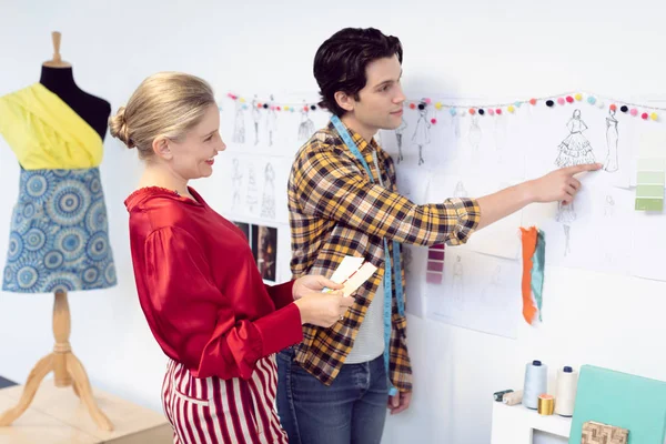 Side View Caucasian Male Female Fashion Designers Discussing Sketch Office — Stock Photo, Image
