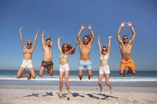 Front View Group Young Diverse Friends Jumping Together Beach — Stock Photo, Image