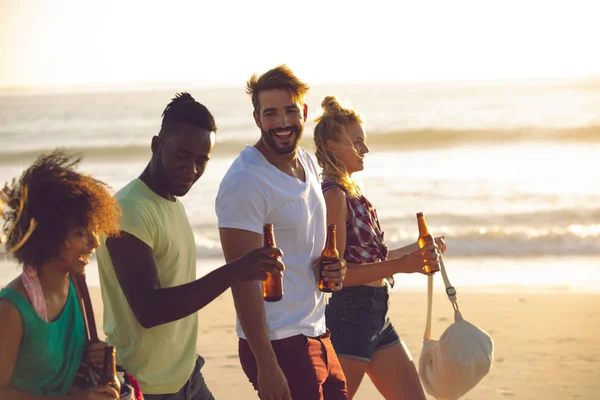 Side View Happy Group Diverse Friends Holding Beer Bottles Walking — Stock Photo, Image