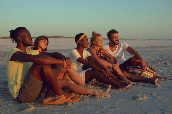 Side View Group Diverse Friends Sitting Together Beach Sunset — Stock Photo, Image