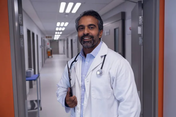 Front View Mature Mixed Race Male Doctor Standing Clipboard Looking — Stock Photo, Image