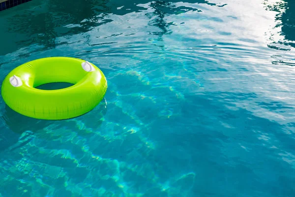Close-up of Inflatable tube floating in a swimming pool in backyard