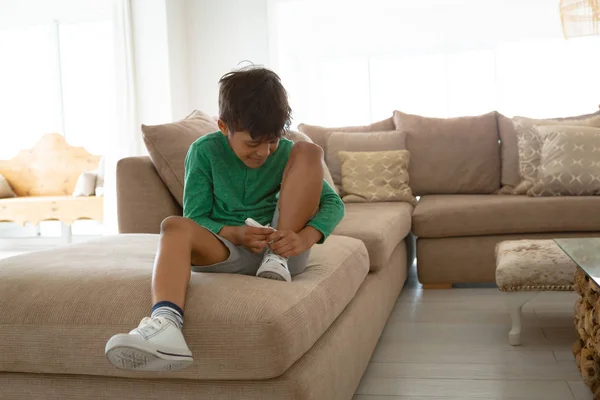 Front View Happy American Boy Tying Shoelace Sofa Living Room — Stock Photo, Image