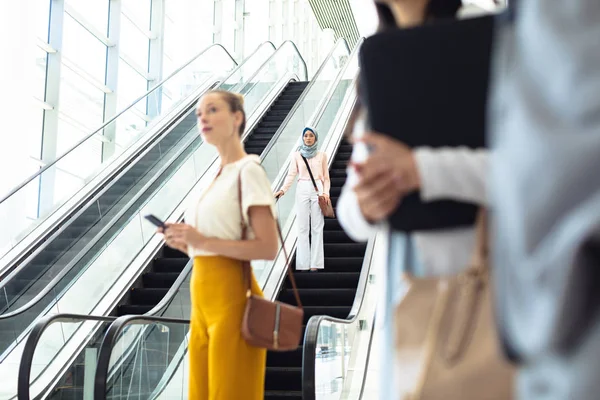 Front View Young Female Executive Taking Escalator While Caucasian Female — Stock Photo, Image