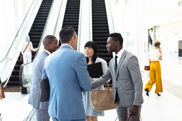 Side View Diverse Young Executives Meeting Front Escalator Modern Office — Stock Photo, Image