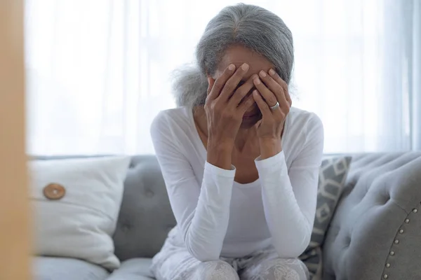 Front View Worried Senior Mixed Race Woman Sitting Couch Home — Stock Photo, Image