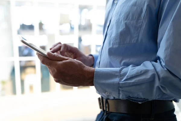 Mid Section Businessman Working Digital Tablet While Standing Window Office — ストック写真