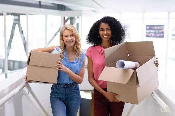 Portrait Young Diverse Female Executives Standing Cardboard Boxes Office — Stock Photo, Image