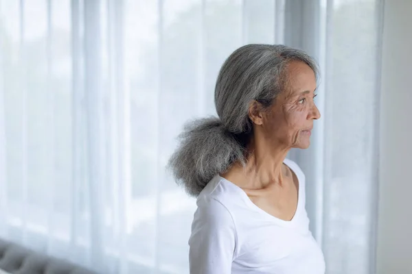 Side View Thoughtful Senior Mixed Race Woman Standing Looking Out — Stock Photo, Image