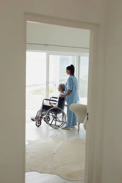 Side View Healthcare Worker Woman Wheelchair Indoor Authentic Senior Retired — Stock Photo, Image