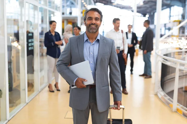 Front View Happy Businessman Holding Laptop Trolley Bag Looking Camera — Stock Photo, Image