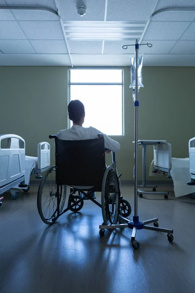 Rear View Disabled Mixed Race Female Patient Looking Window While — Stock Photo, Image