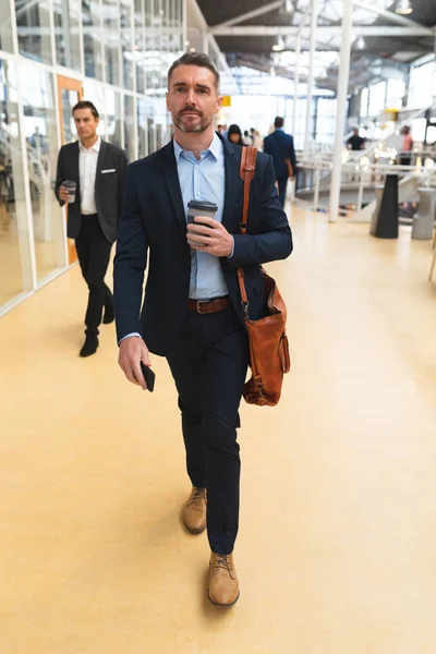 Front View Caucasian Businessman Using Mobile Phone While Walking Corridor — Stock Photo, Image