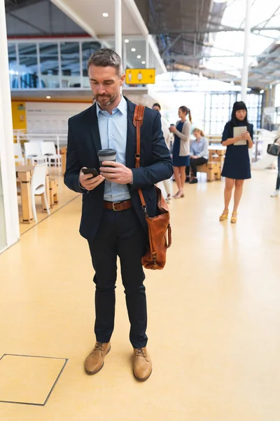 Front View Caucasian Businessman Using Mobile Phone While Standing Corridor — Stock Photo, Image