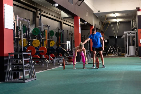 Front View Caucasian Woman Lifting Weights African American Man Assisting — Stock Photo, Image